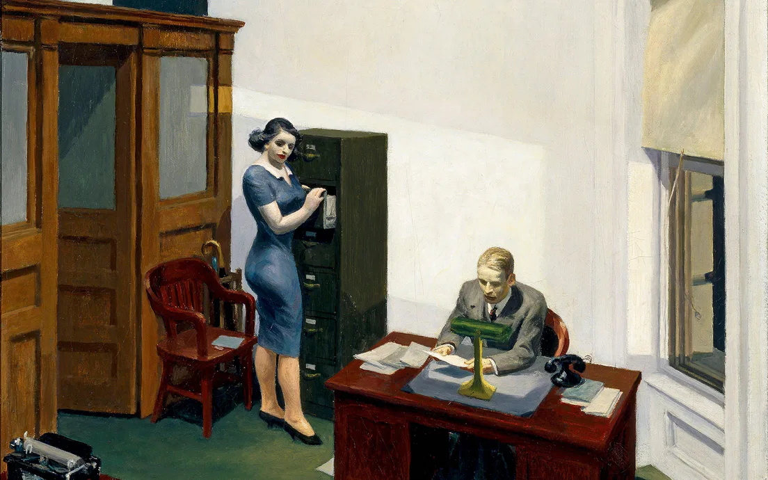 A woman and a man working late in an office